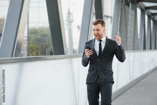 Portrait of an handsome businessman in an urban setting