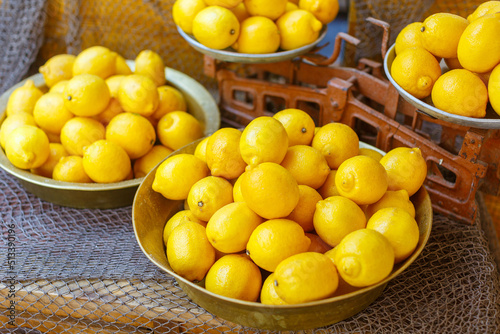 many fresh lemons in the grocery store