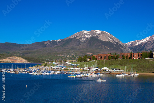 Marina and Rocky Mountain peaks at Dillon Reservoir at dawn in spring