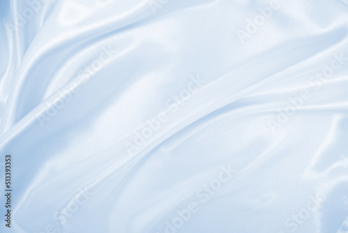 Smooth elegant blue silk or satin luxury cloth texture as abstract background. Luxurious background design