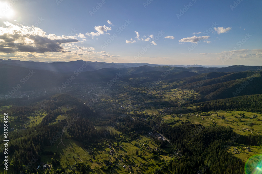 Aerial view of mountains covered with coniferous forests. Aerial View Landscape Mountain. Breathtaking aerial view of the tall mountains covered by the forest. Sunrise Aerial view of mountains covered with coniferous forests. Aerial View Landscape Mountain. Breathtaking aerial view of the tall mountains covered by the forest. Sunrise