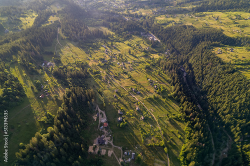 Aerial view of mountains covered with coniferous forests. Aerial View Landscape Mountain. Breathtaking aerial view of the tall mountains covered by the forest. Sunrise