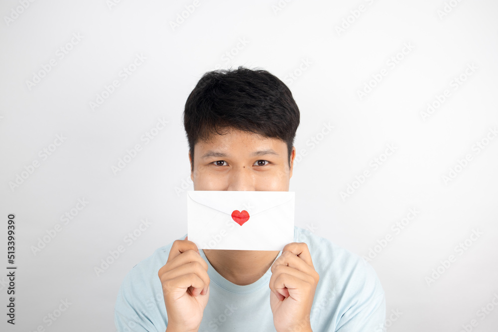 Asian men with love letter Valentine's Day concept Asian men with love letter Valentine's Day concept