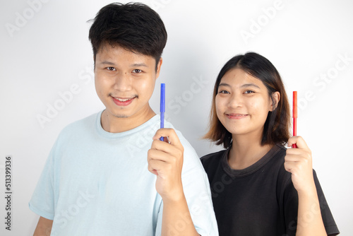 Asian couples with Left Hander's Day concept photo