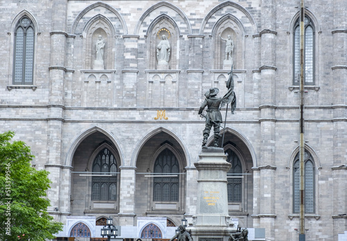 Statue of Paul de Chomedrey in Place d'Armes with Notre-Dame Cathedral as Backdrop photo