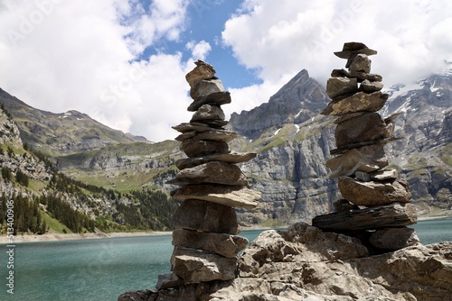 landscape with sky  lake and clouds at the Oeschinensee with rock towers