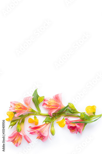 Festive floral background. floral layout from yellow and pink flowers isolated. Top view, flat lay. copy space.
