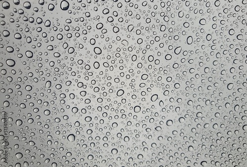 Raindrops on the top window (glass). Water drops on background.