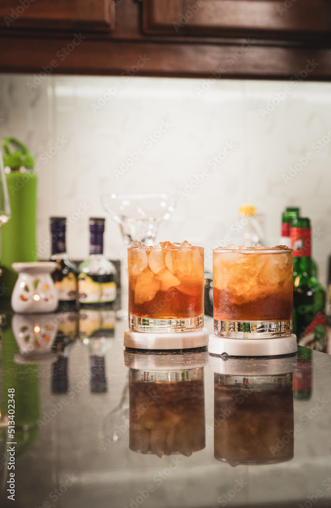 bartender preparing Manhattan drink with cherry and ice
bartender preparing Manhattan drink with cherry and ice