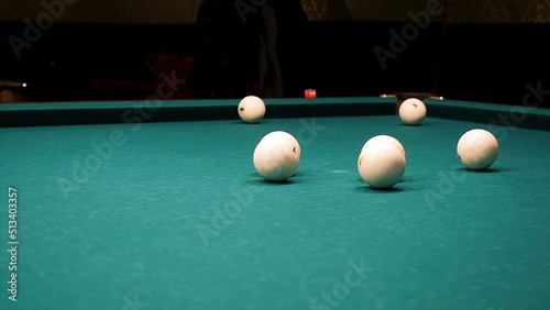 Wallpaper Mural Balls of different number, type, diameter, color, and pattern on a billiard table, billiards table, or pool table covered with green cloth. Balls on a billiard table. White snooker ball on the pool Torontodigital.ca