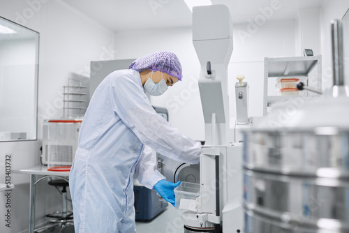 A laboratory worker prepares equipment for the study