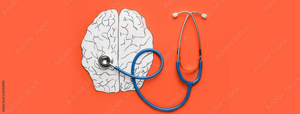 Paper brain and stethoscope on orange background. Concept of brain diseases - obrazy, fototapety, plakaty 