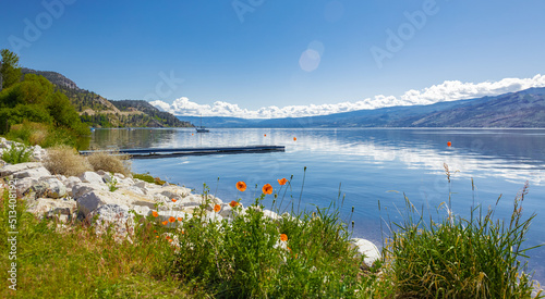 Beautiful summer landscape of a lake and mountains in the background in early morning in Canada photo