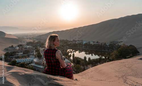 Tourist woman in Huacachina the Oasis of Ica Peru.