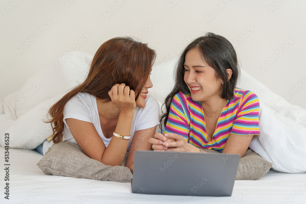 Young Asian Women LGBT lesbian couple love moments happiness at bedroom. LGBTQ or Gay and pride concpet. Young Asian Women LGBT lesbian couple love moments happiness at bedroom. LGBTQ or Gay and pride concpet.
