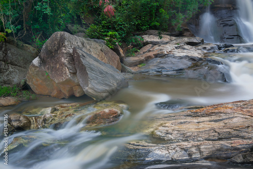 Fototapeta Naklejka Na Ścianę i Meble -  Beautiful Turga waterfall having full streams of water flowing downhill amongst stones , duriing monsoon due to rain at Ayodhya pahar (hill) - at Purulia, West Bengal, India.