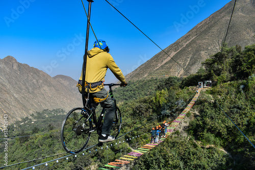 Aerial extreme sport, EXTREME FLYING BIKE, tourist attraction in San Mateo de Otao - Peru.