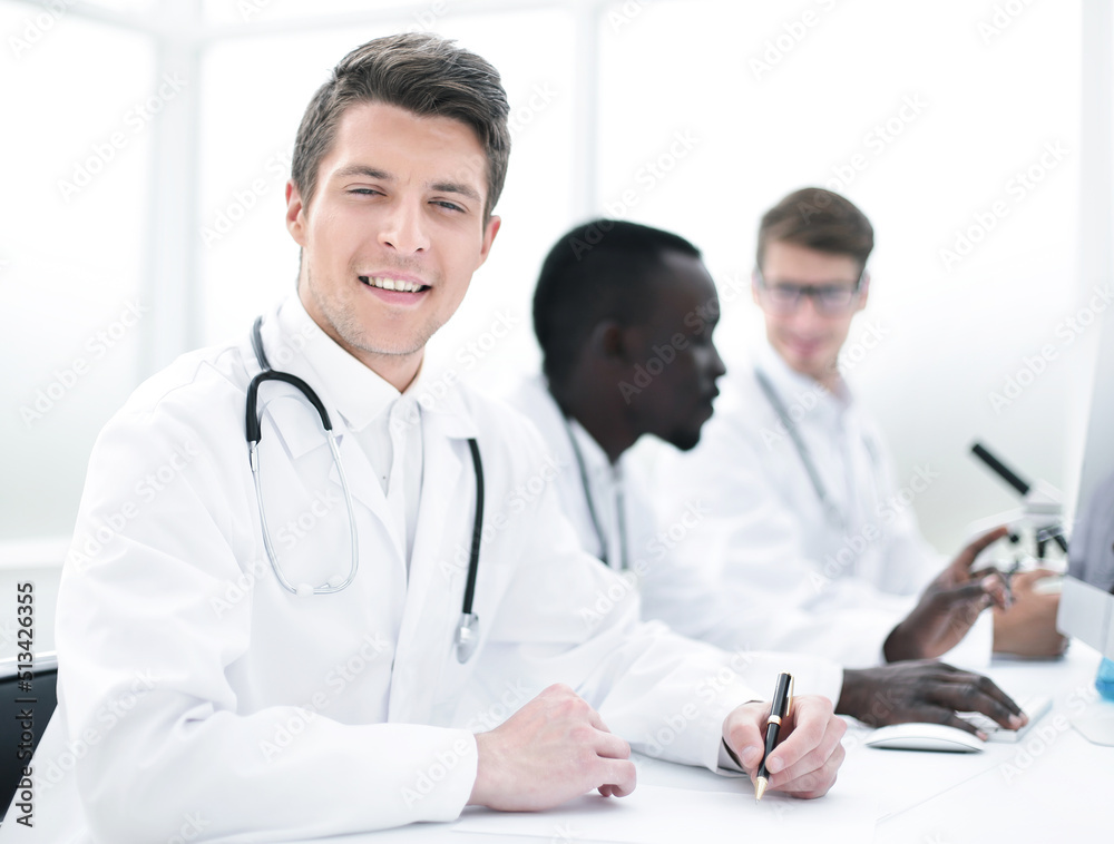 doctor writing down the data in the laboratory journal doctor writing down the data in the laboratory journal