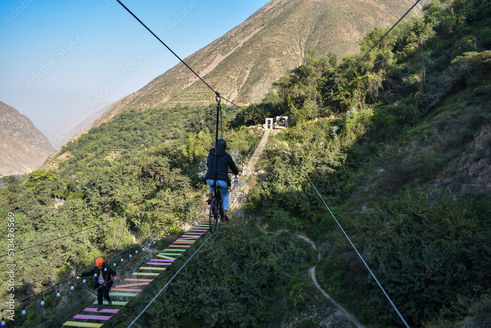 Obraz premium Aerial extreme sport, EXTREME FLYING BIKE, tourist attraction in San Mateo de Otao - Peru.