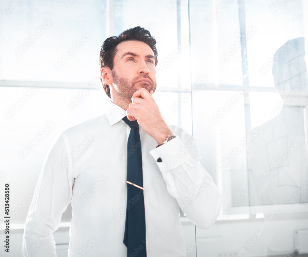 dreaming businessman standing in the office.