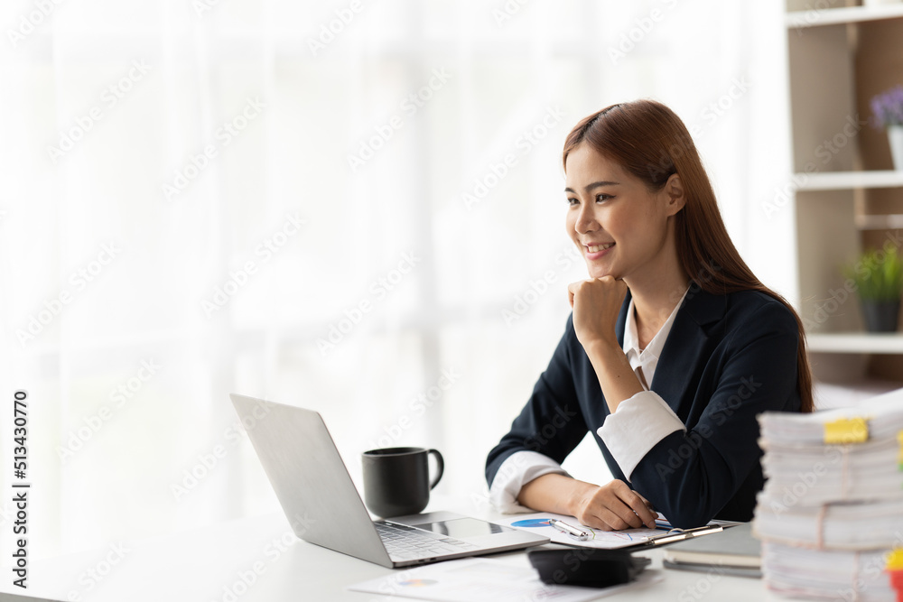 Portrait of smiling beautiful business asian woman working in office use computer with copy space. Business owner people sme freelance online marketing e-commerce telemarketing, work from home concept Portrait of smiling beautiful business asian woman working in office use computer with copy space. Business owner people sme freelance online marketing e-commerce telemarketing, work from home concept