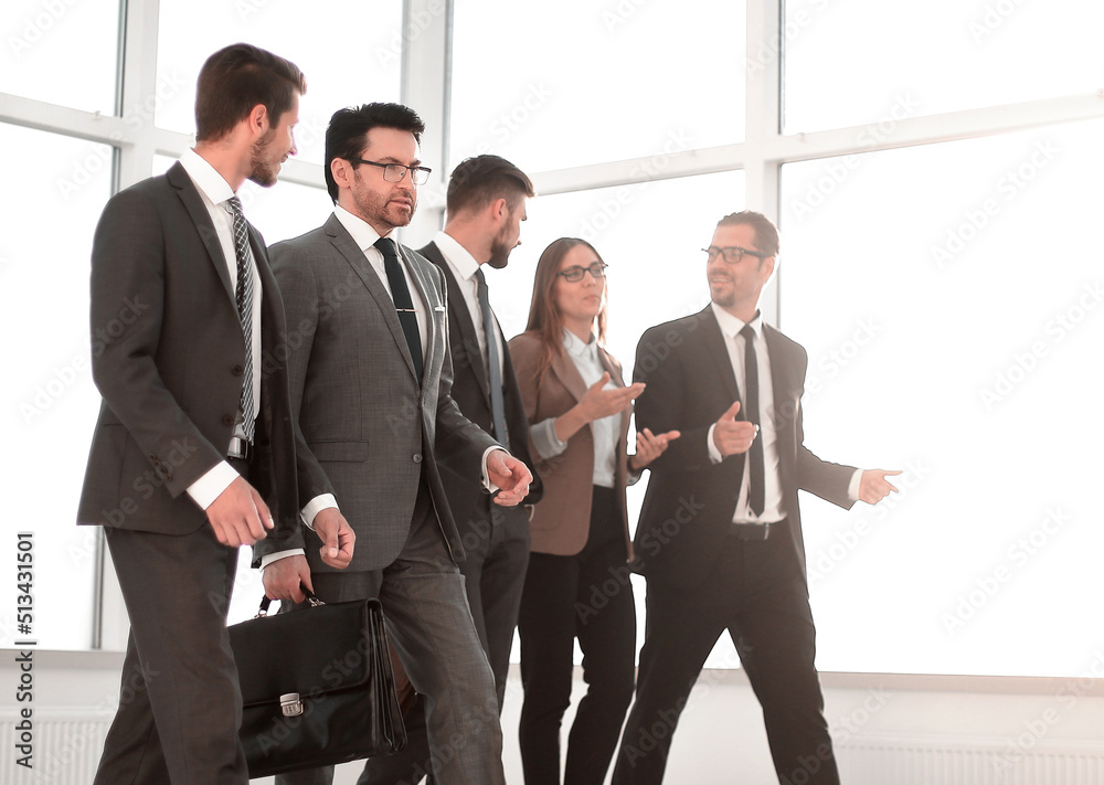 Businesspeople walking in the office background. Businesspeople walking in the office background.