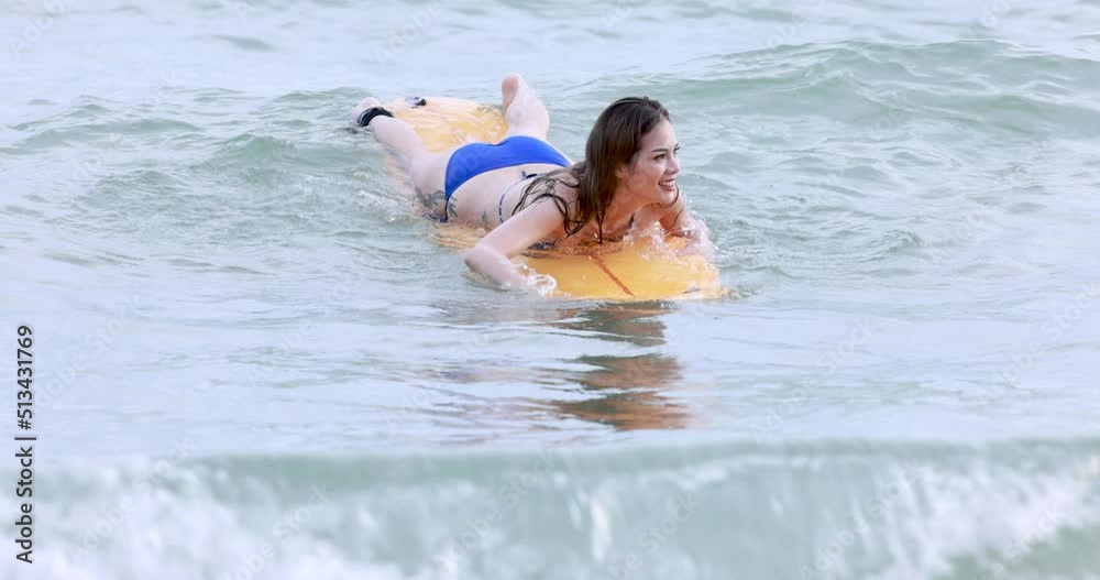 Young Asian women wearing bikini playing relaxing with surfboard enjoying summer vacation, 4k video Young Asian women wearing bikini playing relaxing with surfboard enjoying summer vacation, 4k video