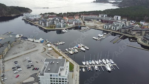 Aerial looking down at piren and sjosanden at Marna river mouth in Mandal - Calm evening aerial Norway photo