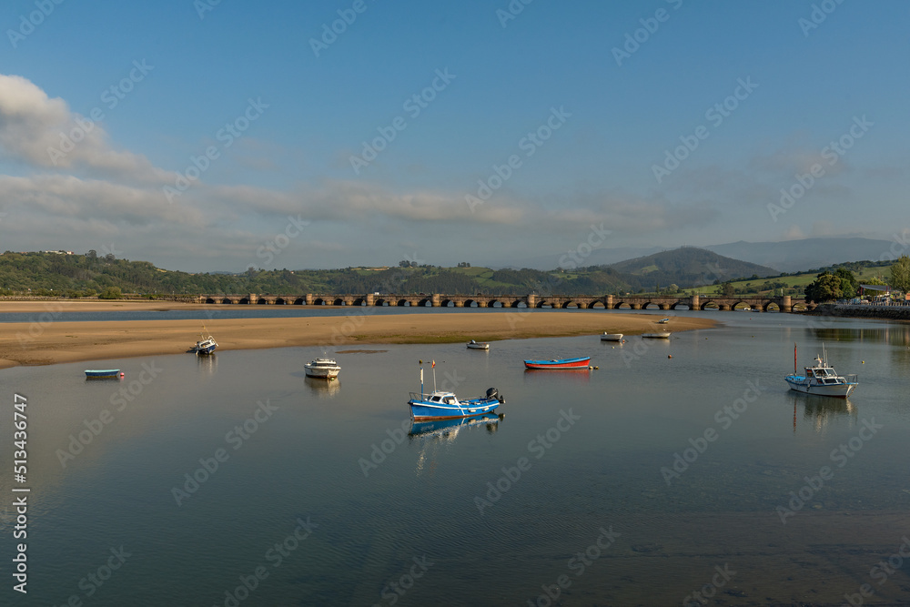 old stone bridge in San Vicente de la Barquera, Cantabria, Spain