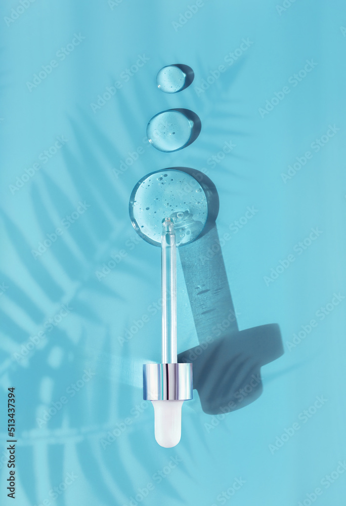 pipette drop of serum test on a blue background pipette drop of serum test on a blue background