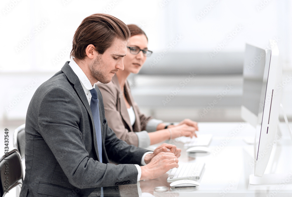 business woman discussing with a colleague working documents business woman discussing with a colleague working documents