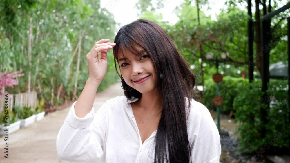 Close up portrait shot of beautiful young woman smiling with happy, enjoying lifestyle stylish attractive female looking to camera and having wide toothy charming smile at outdoor Close up portrait shot of beautiful young woman smiling with happy, enjoying lifestyle stylish attractive female looking to camera and having wide toothy charming smile at outdoor