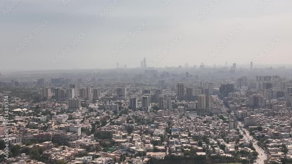 Aerial View Over Karachi Skyline In Pakistan With Haze Seen In The Distance. Dolly Left Aerial View Over Karachi Skyline In Pakistan With Haze Seen In The Distance. Dolly Left