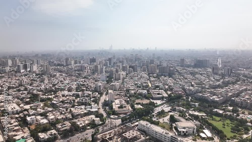 Aerial Flying Over Karachi City Skyline In Pakistan With Haze Seen In The Distance. Dolly Forward photo