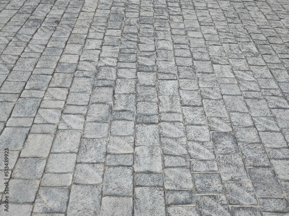 Granite cobblestone background. Paving stone texture. Pavement. Granite cobblestone background. Paving stone texture. Pavement.