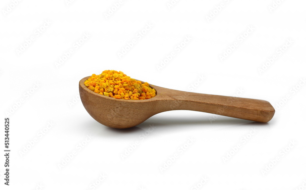 Pollen pile with wooden spoon isolated on white background Pollen pile with wooden spoon isolated on white background