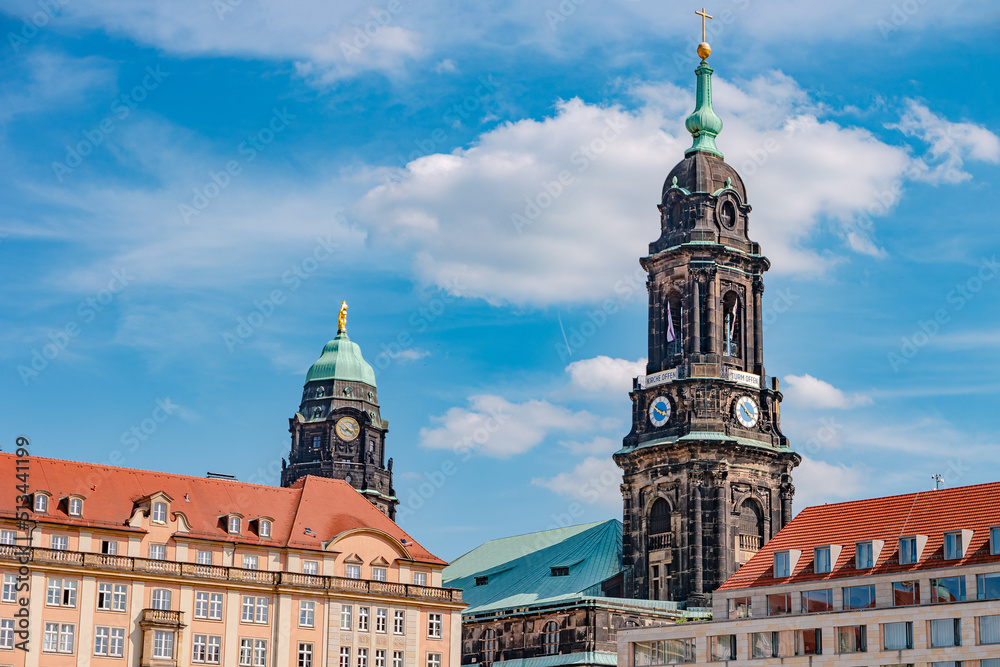 Fototapeta premium Herbstmarkt and Holy Cross Church bell and clock tower. Panoramic cityscape of beautiful modern Dresden. Historical, touristic and shopping center in downtown of Dresden.