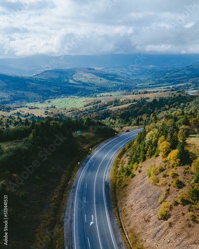 aerial view of speedway road in autumn carpathian mountains