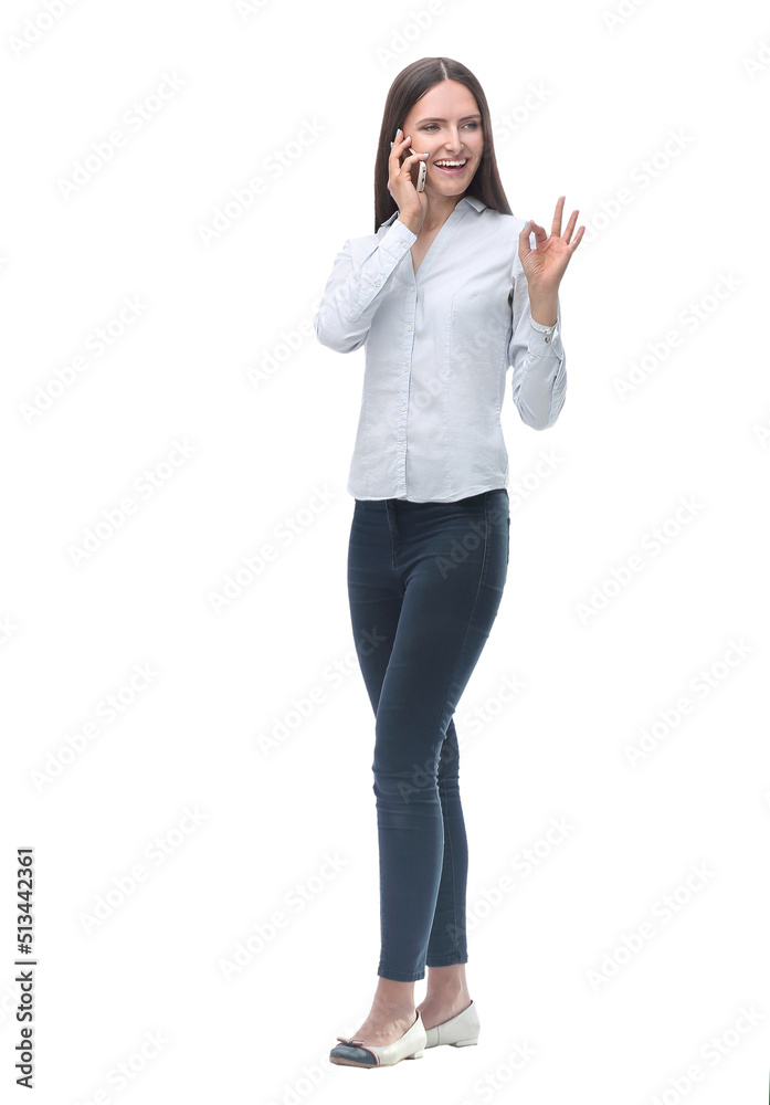 smiling young woman talking on her smartphone. isolated on white smiling young woman talking on her smartphone. isolated on white