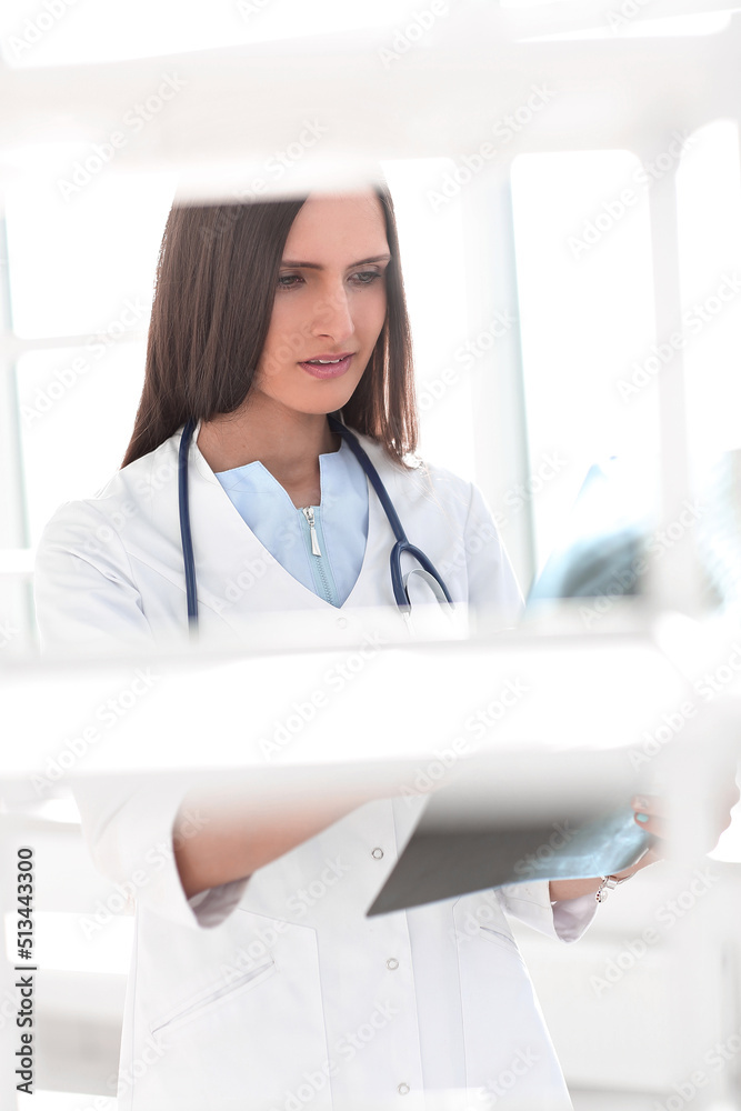 background image of smiling woman doctor with patient x-ray background image of smiling woman doctor with patient x-ray
