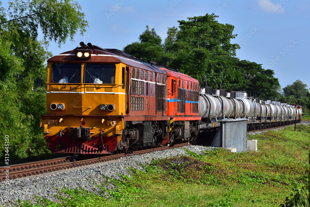 Thai tanker freight-train by diesel locomotive on the railway.