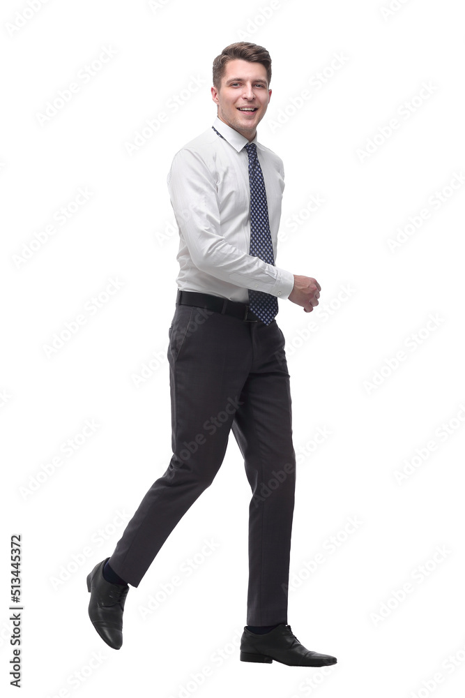 successful young businessman confidently goes forward.isolated on white successful young businessman confidently goes forward.isolated on white