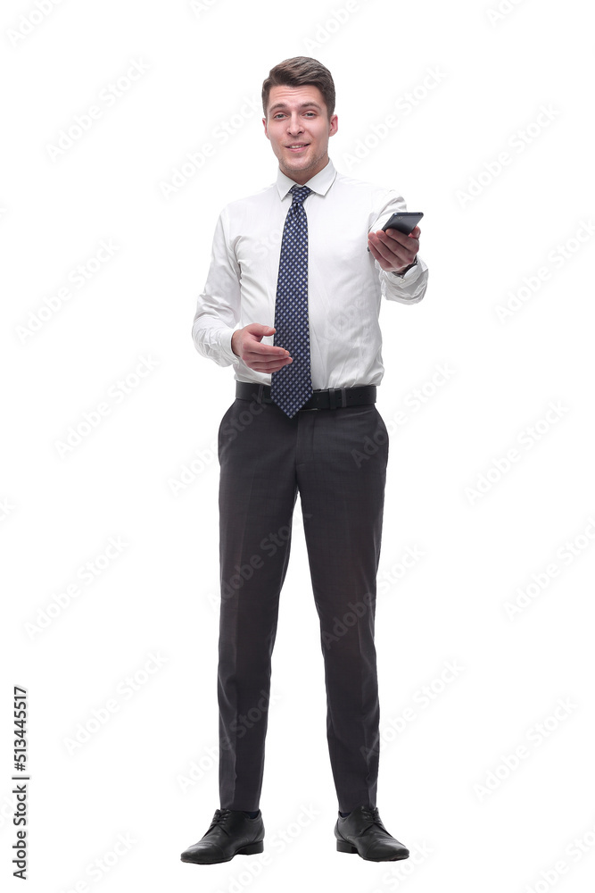 friendly young businessman with smartphone. isolated on white friendly young businessman with smartphone. isolated on white