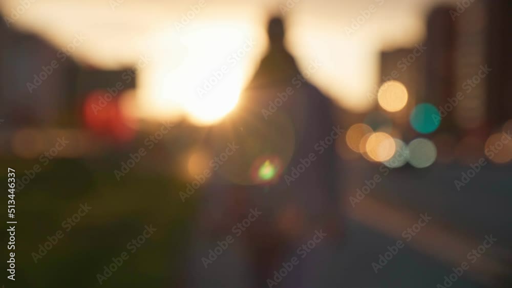 Abstract sunrise over road cars street. Urban sunrise human shadow, urban background, defocusing Abstract sunrise over road cars street. Urban sunrise human shadow, urban background, defocusing
