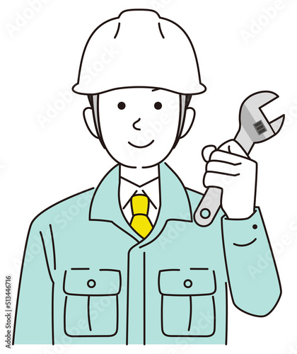 レンチを持つ作業員男性