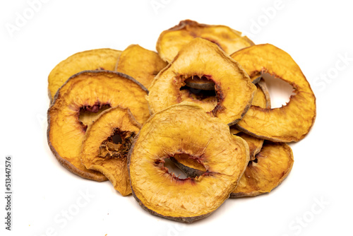 Dried peach slices. Sliced dry peach isolated on white background. Sun-dried fruit. Close up © enezselvi