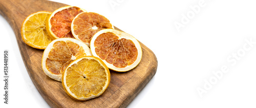 Dried orange slices. Sliced dried orange isolated on a white background. Sun-dried fruit. close up. Copy space