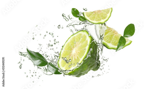 Fototapeta Naklejka Na Ścianę i Meble -  Fresh ripe bergamot fruits, green leaves and splashing water on white background