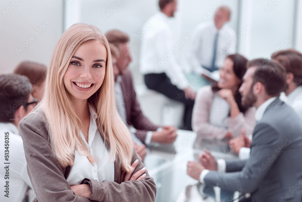 close up. smiling young employee standing in the office close up. smiling young employee standing in the office