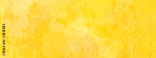 Abstract bright texture of yellow paint,  bright and shinny yellow watercolor background with space, yellow background for any design and wallpaper.